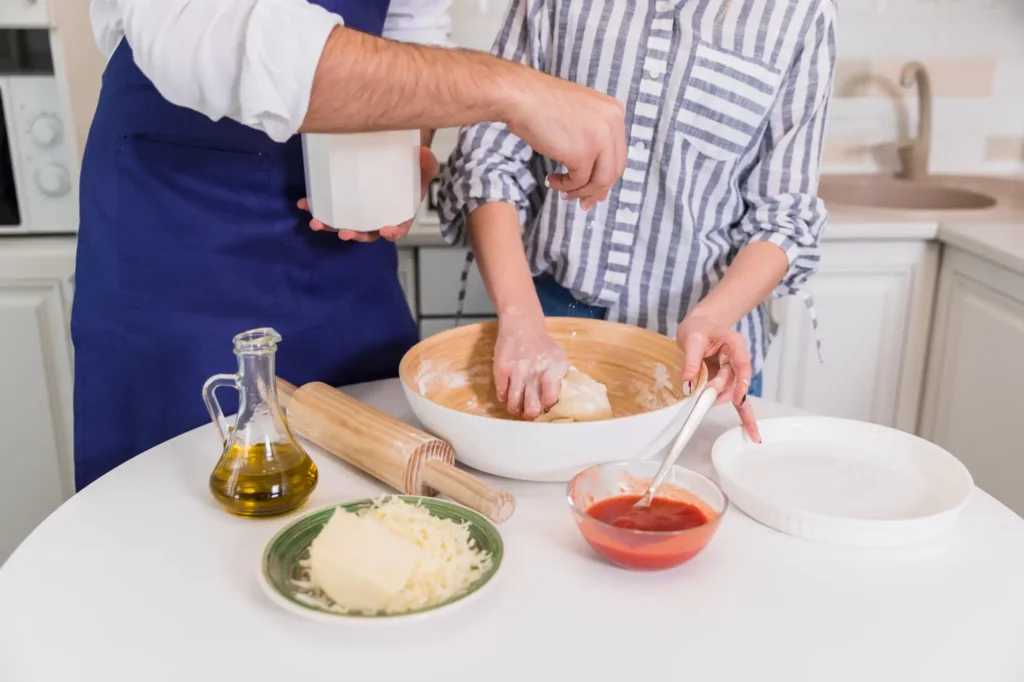Pictured two guests attending a cooking class.